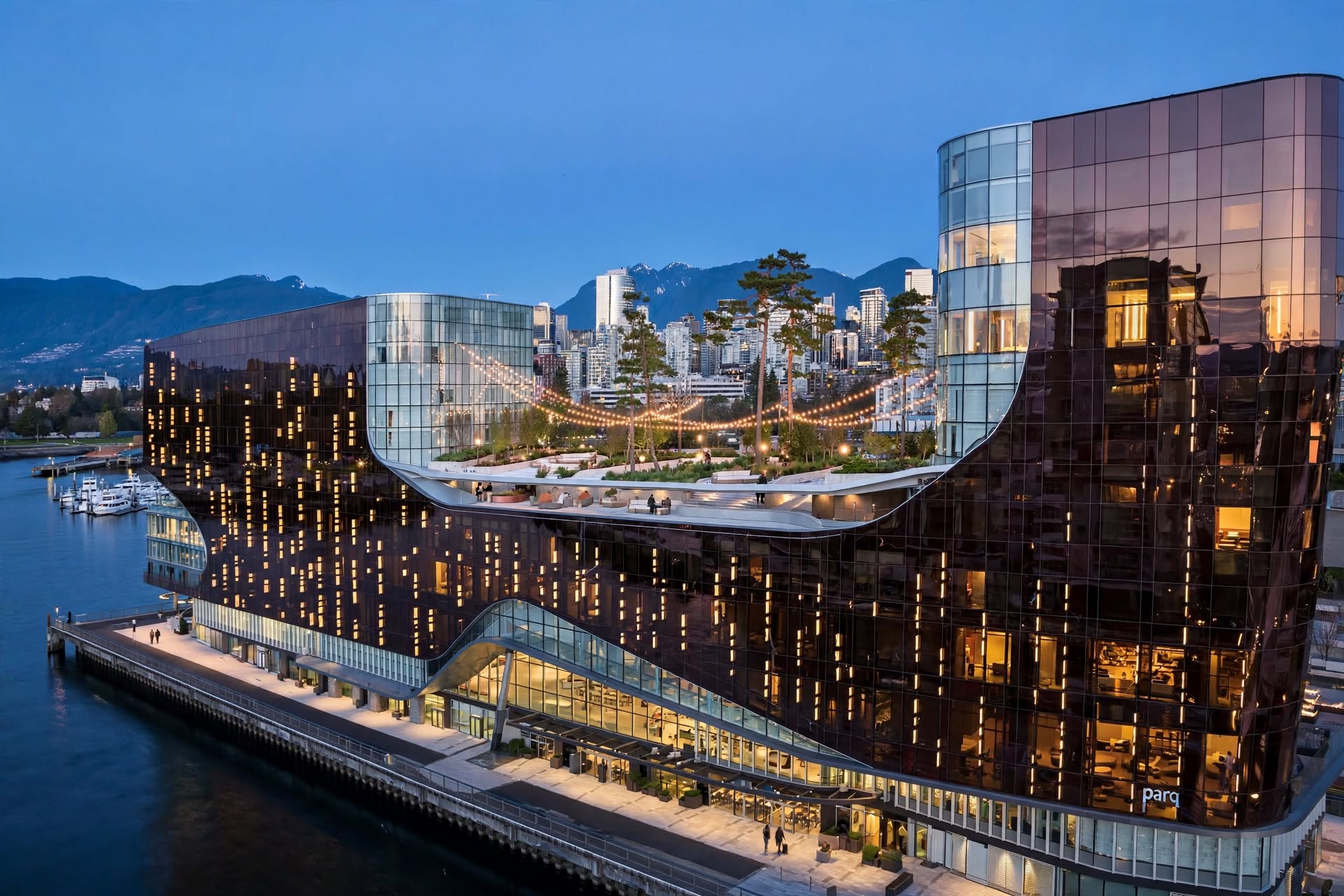 Parq Vancouver urban casino hotel with glass facade and elevated park